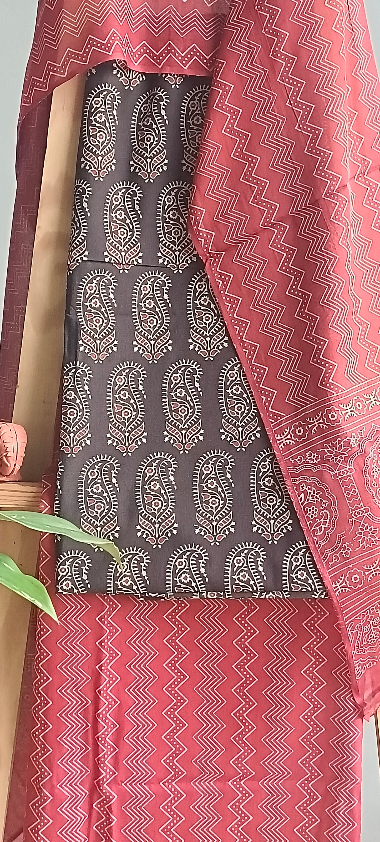 Brick red 'n' black ajrakh hand block print cotton suit.